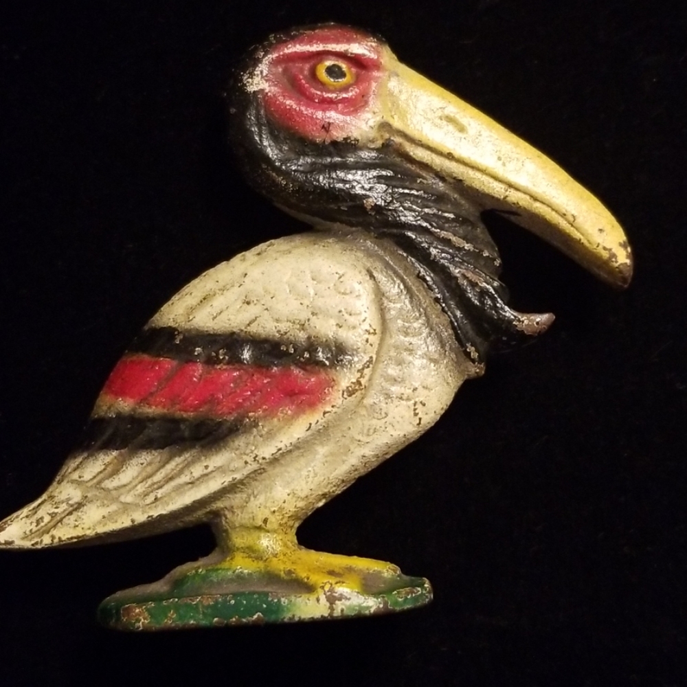 Antique Pelican bottle opener.
